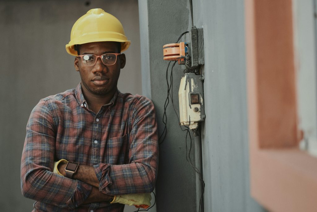 HVAC worker standing near electrical equipment