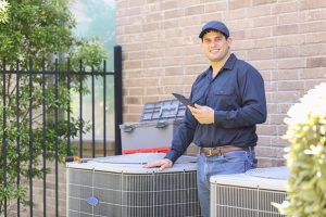 Worker with air conditioner unit in Oregon