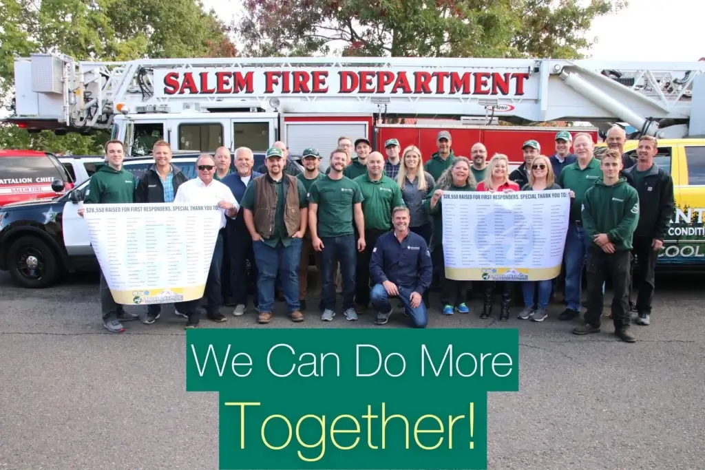 Advantage workers pose next to Salem fire department vehicles