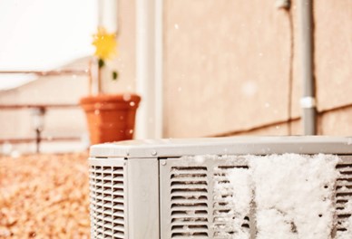 Air Conditioner outside with snow 
